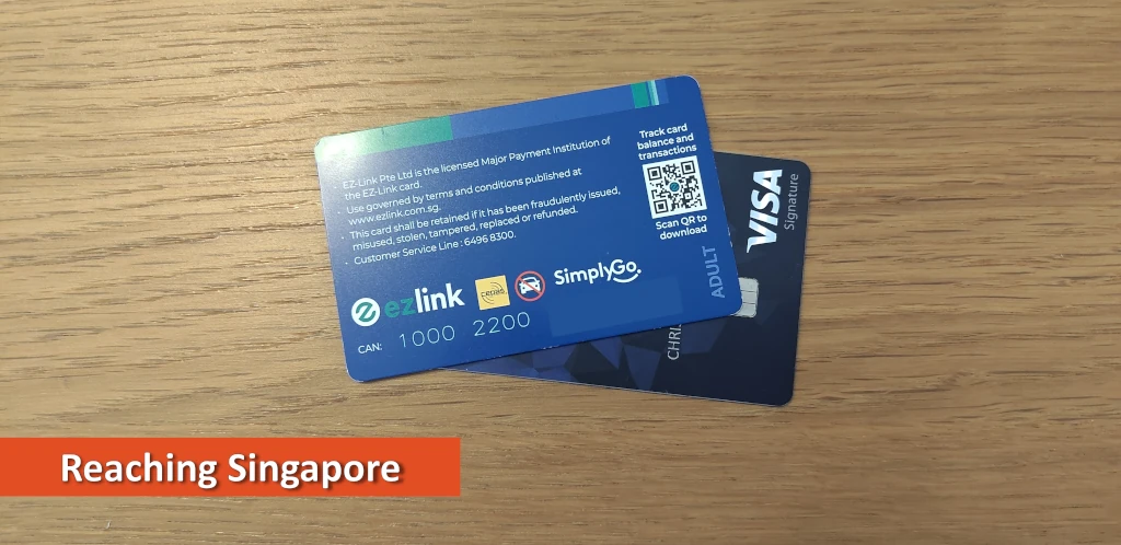 Photo of SimplyGo card stacked on a Visa credit card