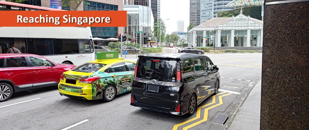 Photo of two taxis waiting at traffic lights